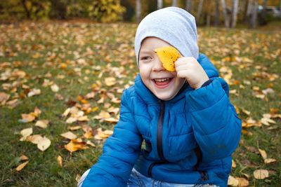 Portrait of smiling boy in snow