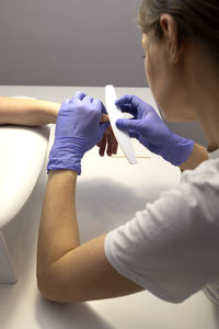 Side view of woman exercising at home