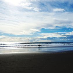 Scenic view of beach against sky