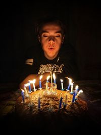 High angle view of boy on table at night