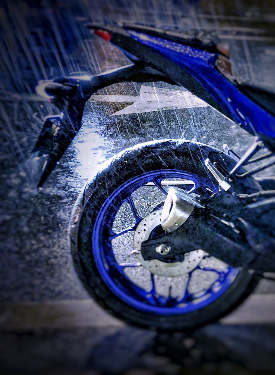 HIGH ANGLE VIEW OF WET BICYCLE IN RAIN