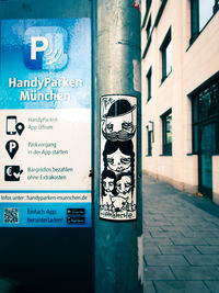 Information sign on wall in city