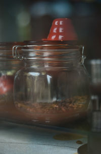 Close-up of glass jar on table