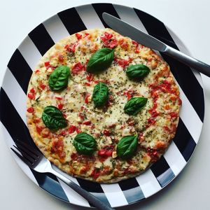 High angle view of pizza in plate on table