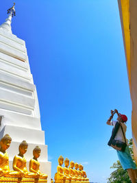 Low angle view of traditional building against clear blue sky