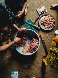 High angle view of people preparing food