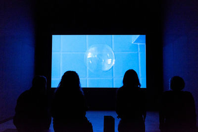 Reflection of people on glass