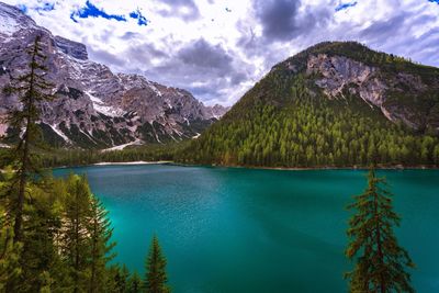 Scenic view of lake and mountains against sky