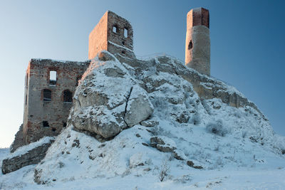 Low angle view of old building against sky