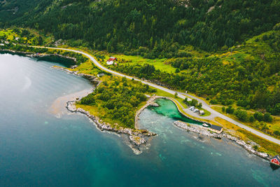 Aerial view of field by sea