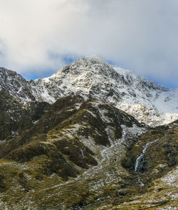 The snow-capped summit of snowdon  in the snowdonia national park in north wales, uk