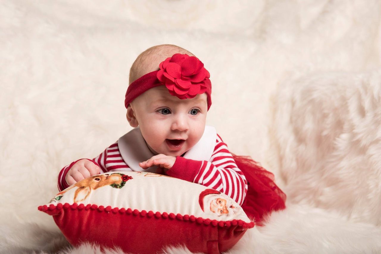 christmas, child, celebration, looking at camera, happiness, childhood, portrait, baby, people, one person, red, males, mouth open, christmas present, winter, smiling, holiday - event, babyhood, human body part, indoors, formal portrait, day