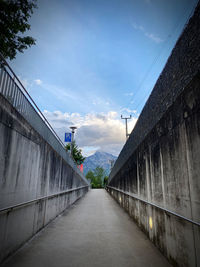 Empty road along buildings