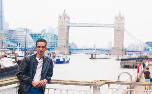 Portrait of man standing in city