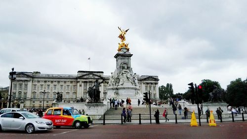 Low angle view of statue against cloudy sky