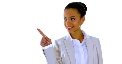 Portrait of young woman against white background
