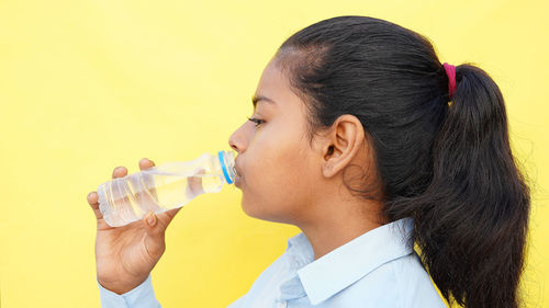 Young woman drinking water