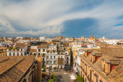 High angle view of buildings in town against sky