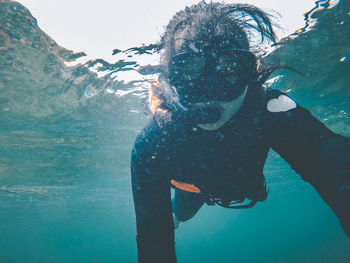 Woman swimming in undersea