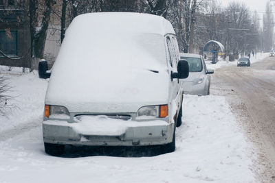 Car on snow covered street