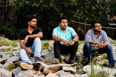 Two men and people on bridge