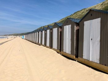 Beach huts against sky