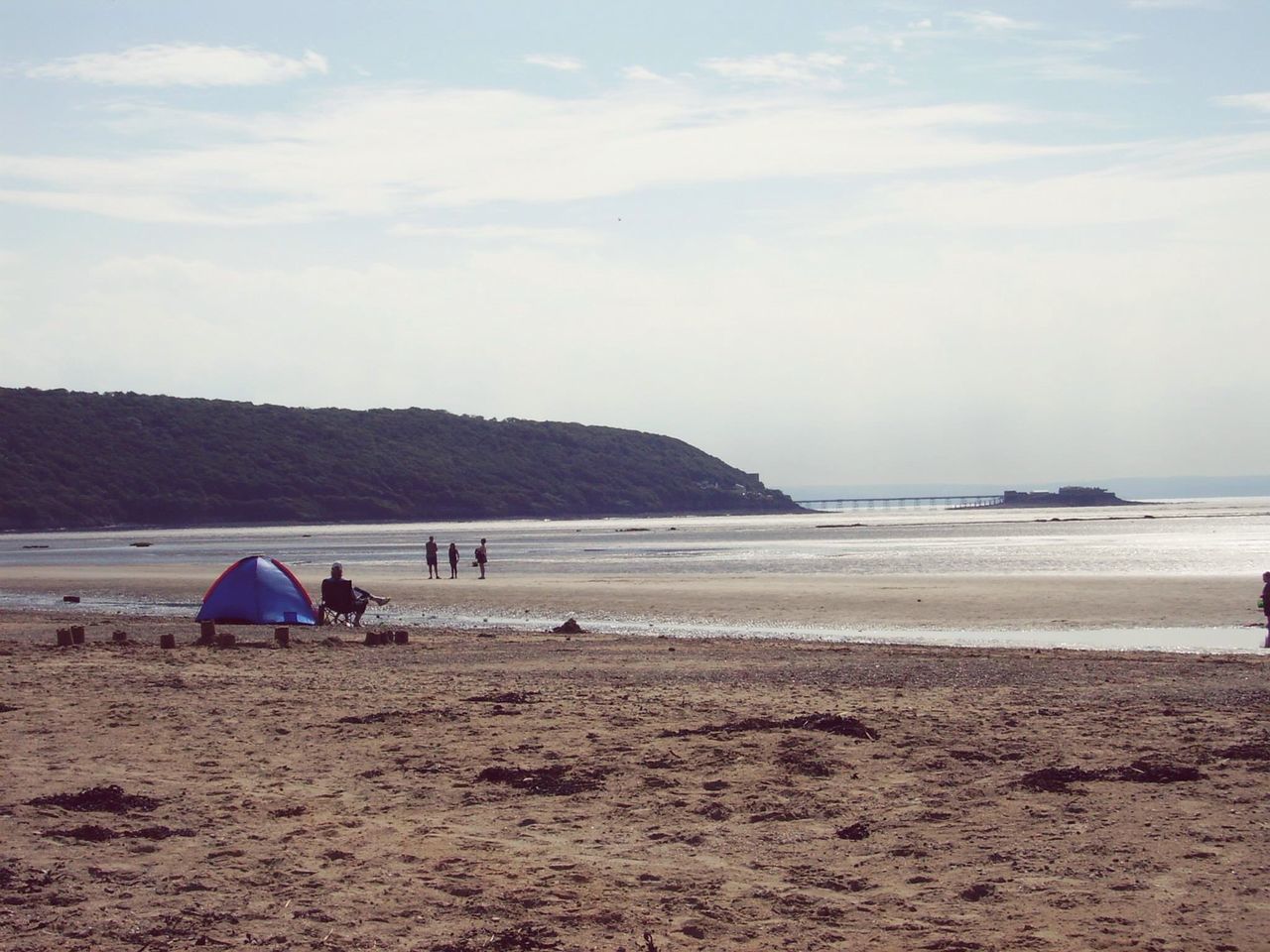 beach, sand, sea, water, shore, sky, tranquil scene, tranquility, scenics, vacations, beauty in nature, nature, leisure activity, incidental people, horizon over water, coastline, lifestyles, relaxation, idyllic