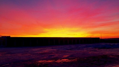 Scenic view of dramatic sky at sunset