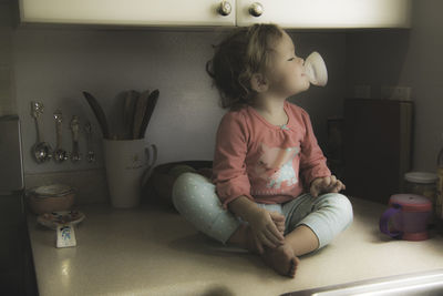 Girl sitting at home