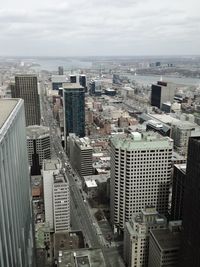 High angle view of buildings in city against sky