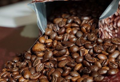 Close-up of coffee beans on table