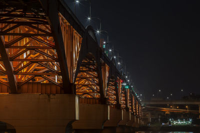 Illuminated seongsan bridge against sky at night