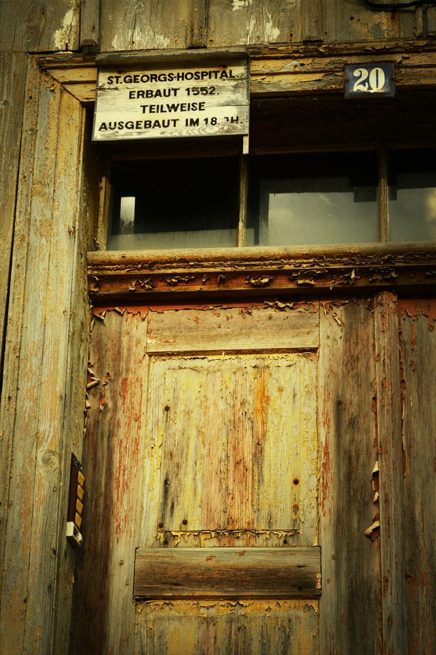 wood - material, text, architecture, built structure, building exterior, communication, western script, door, wooden, house, old, wood, window, weathered, non-western script, no people, closed, day, outdoors, residential structure