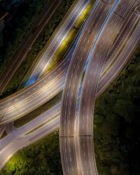 High angle view of light trails on road in city