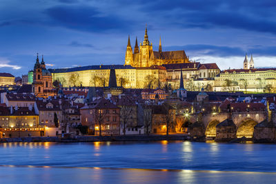 Evening view of prague castle over river vltava.