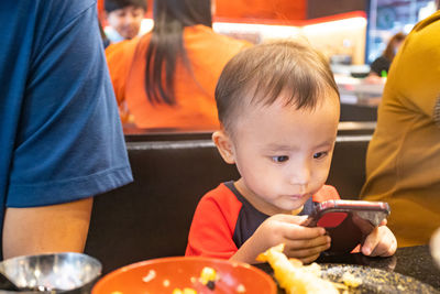 Portrait of boy eating food