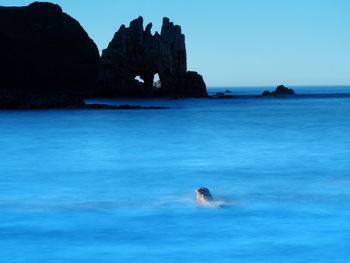 Scenic view of sea against clear sky