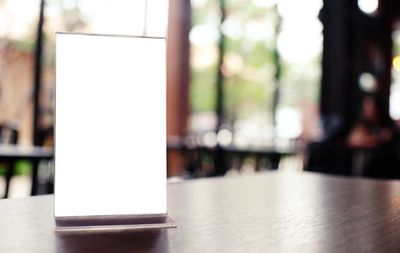 Close-up of white paper on table