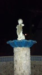 Low angle view of statue at night