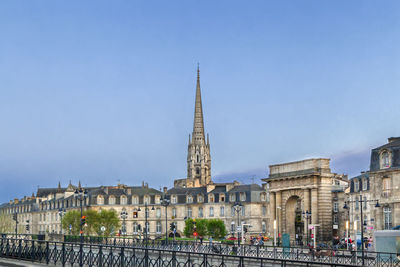 Buildings in city against sky