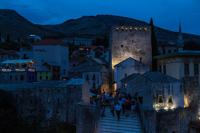 Buildings in city at dusk