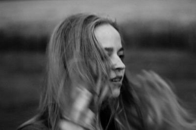 Portrait of a young woman looking away