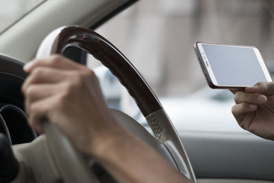 Low angle view of man using mobile phone