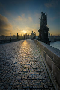 View of statue at town square during sunset