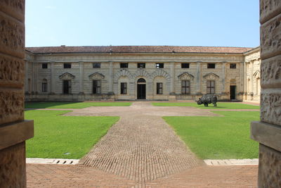 Facade of historic building against clear sky