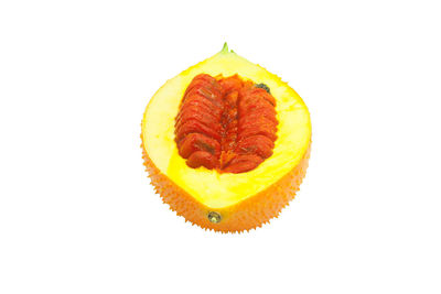 Close-up of orange slice against white background