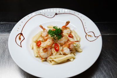 Close-up of pasta served in plate