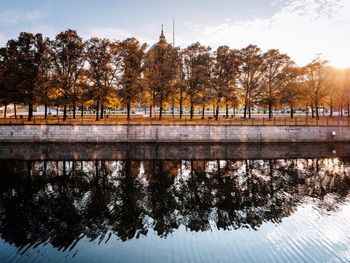 Reflection of trees in lake against sky