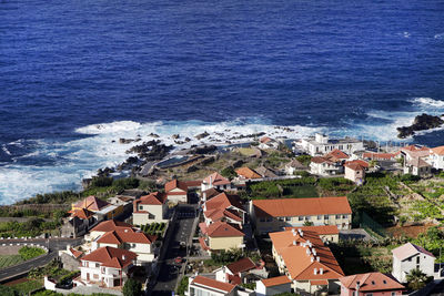 High angle view of town by sea