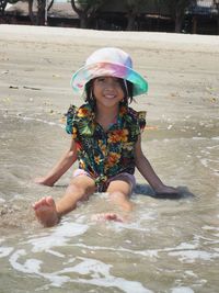 Portrait of a smiling girl in water